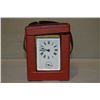 Image 1 : Antique brass French carriage clock with enamelled dial, key and leather carrying case