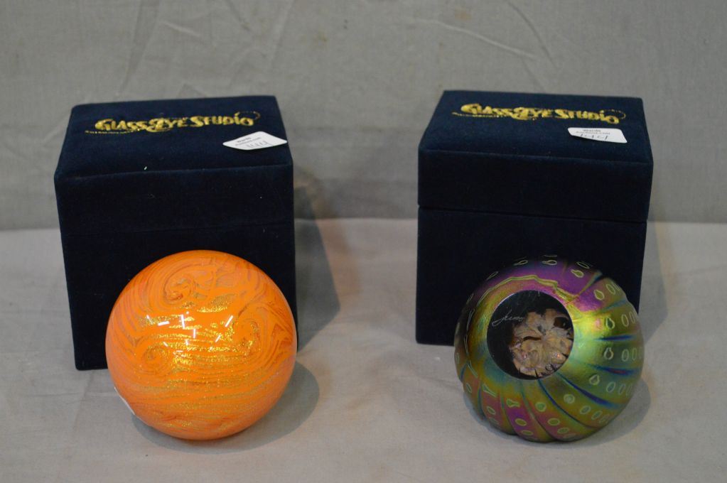 Two boxed Glass Eye Studio paperweights including Sun and Juno Astroid