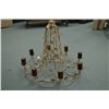 Image 1 : Eight branch leaf motif wrought iron chandelier lit by candles