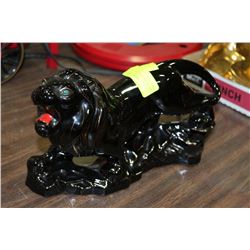 1960'S BLACK & GOLD LION WITH GREEN EYES