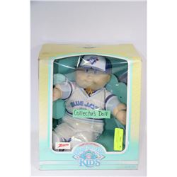 "CABBAGE PATCH KIDS" DOLL WEARING A BLUEJAYS