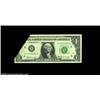 Image 1 : Fr. 1905-H $1 1969B Federal Reserve Note, About Uncirculated. A dramatic foldover error that shows p