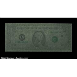 Fr. 1909-L $1 1977 Federal Reserve Note. About Uncirculated.A spectacular error previously sold in t
