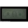 Image 1 : Fr. 1909-L $1 1977 Federal Reserve Note. About Uncirculated.A spectacular error previously sold in t