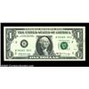 Image 1 : Fr. 1905-B $1 1969B Federal Reserve Note. About Uncirculated. One of the numbers has failed to print