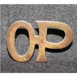 B19. O P Shoulder title. Brass metal