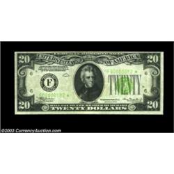 Fr. 2054-F* $20 1934 Federal Reserve Note. Very Fine.This very scarce star note, with the three-digi
