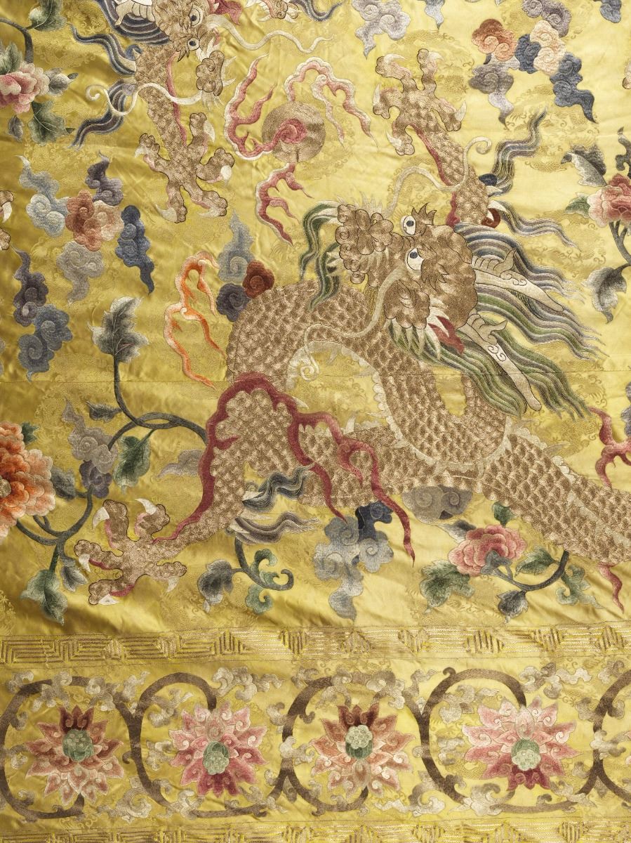 A CHINESE SILK EMBROIDERED BLANKET OVERLAY