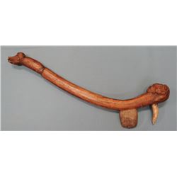 Carved ceremonial war club & pipe with axe head and large bear claw.