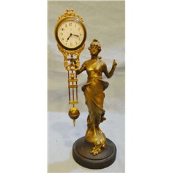 Lady statue wiggle tail clock, crossed arrow trademarks