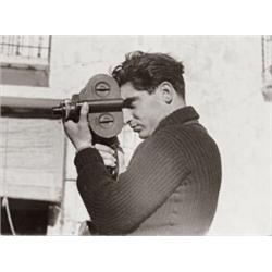 ROBERT CAPA, (American, b. Hungary, 1913-1954), SELF-PORTRAIT, "CAPA, ROBERT" inscribed on verso,...