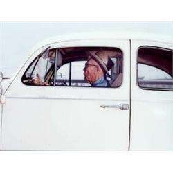 ANDY BUSH, (American, b. 1957), MAN ROLLING ALONG ON HIGHWAY #101 AT APPROXIMATELY 55 MPH AROUND ...