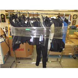 Rack full of new Bare wet suits