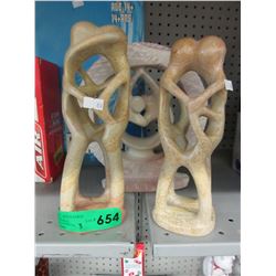 3 Carved stone statues