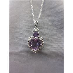 2 Heart cut Amethyst pendants set with a Diamond