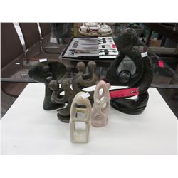 6 Carved stone statues