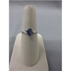 Oval Tanzanite ring set with 6 Diamonds