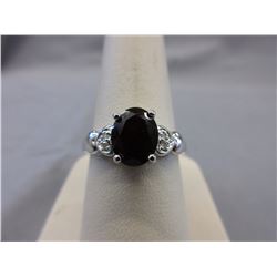 2.10 CT Oval Garnet ring set with 4 Diamonds