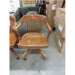 Vintage oak office chair on casters