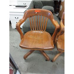 Vintage oak office chair on casters