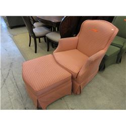 Used upholstered armchair with footstool