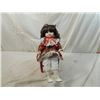 Image 1 : PORCELAIN DOLL ON RED DOLL CHAIR