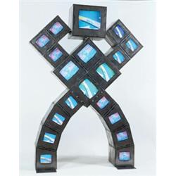 Property of Enron NAM JUNE PAIK (b. 1932) RETROBOT welded steel, 19 color televisions and two