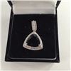 Image 2 : ONE 14KT WHITE GOLD DARK BLUE SAPPHIRE AND DIAMOND PENDANT. SET WITH ONE 4.58CT NATURAL, UNTREATED