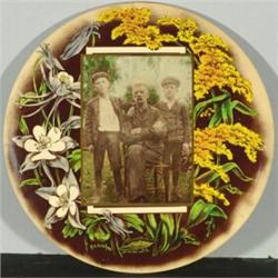 [Photographic Novelty], A circular photographic plaque of celluloid and metal containing image...