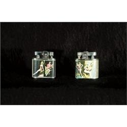 [RisquT Photographic Novelty], A pair of photographic novelty lighters with risquT images of wo...