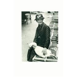 Boubat, Edouard (1923-1999), OLD LADY WITH GOOSE, PARIS, a gelatin silver print. Matted and fra...