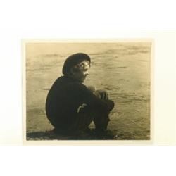 Flaherty, Francis Hubbard (1886-1972), UNTITLED, a vintage gelatin silver print of a boy sittin...