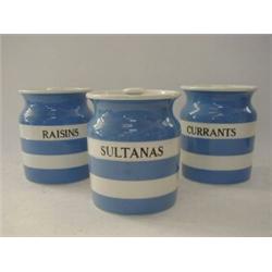 THREE T.G. GREEN BLUE CORNISH WARE JARS, and covers, 'Sultanas', ' Raisins', and 'Currants', blac...