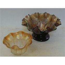 AN AMETHYST CARNIVAL GLASS DISH, Texas Rose pattern, diameter 20cm and a marigold tinted glass di...