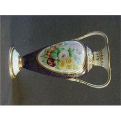 A J. AYNSLEY TWIN HANDLED BALUSTER VASE, oval panel of painted flowers on a gilt and cobalt blue ...