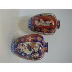 A PAIR OF ORIENTAL IMARI BALUSTER VASES, early 20th Century, figure panels, exotic birds and foli...