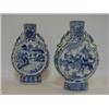 Image 1 : A PAIR OF ARITA TYPE MOONFLASKS, one with battle scenes, the other water buffalo, height 25cm (2)...