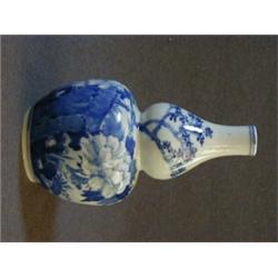 A CHINESE EXPORT DOUBLE GOURD VASE, underglaze blue peony and insect decoration, pseudo reign mar...