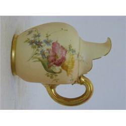 A ROYAL WORCESTER BLUSH IVORY TUSK JUG, 1900, gilt handle, florally decorated, No. 1094, height 1...