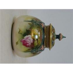A ROYAL WORCESTER POT POURRI VASE, 1910, pierced cover, framed floral panels, No. 175, height 12c...
