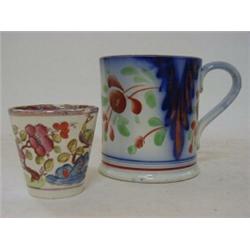 A PEARLWARE MUG, early 19th Century, naive floral decoration, copper lustre detailing, height 11c...