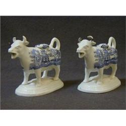 A PAIR OF COW CREAMERS, oriental blue transfers, height 12cm (2), (horns chipped)  30-50...