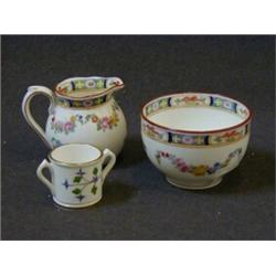 A MINTONS MINIATURE CREAM JUG AND SUGAR, and twin handled cup, polychrome decorated (3)  20-30...
