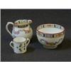 Image 1 : A MINTONS MINIATURE CREAM JUG AND SUGAR, and twin handled cup, polychrome decorated (3)  20-30...