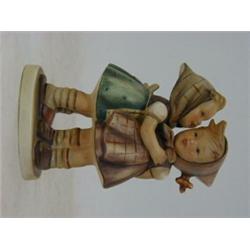 A HUMMEL FIGURE GROUP, Telling her a Secret, No. 196/0, 1948, height 14cm  30-50...