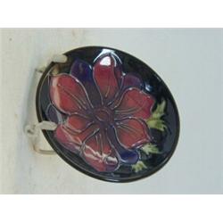 A MOORCROFT TRINKET DISH, tube-lined flower head, diameter 12cm  30-40...