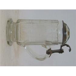 A CLEAR GLASS TANKARD, broad flute cut, domed faceted lid in pewter mount, wheel engraved '1874' ...