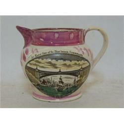A SUNDERLAND PINK LUSTRE JUG,  transfer printed view of New Bridge, Sunderland and motto reverse,...