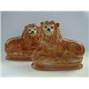 Image 1 : A PAIR OF RECUMBENT LION FIGURES, early 20th Century, inset glass eyes, height 26cm, (firing dama...
