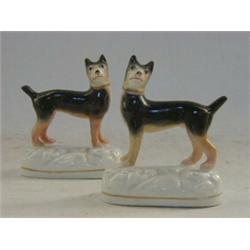 A PAIR OF STAFFORDSHIRE HOUNDS, mid 19th Century, standing on oval plinths, height 9cm, (2)  80-1...